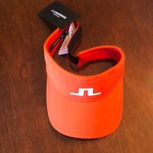J.Lindeberg golf visor in tomato red new with tags. Original price is $35